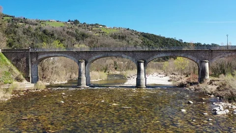 Aerial view of an old bridge over the river, nice french countryside Video stock 128157175