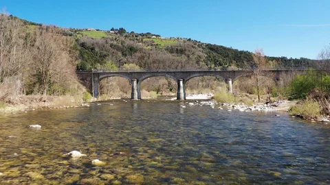 Aerial view of an old bridge over the river, nice french countryside, travelling 動画素材 128160231