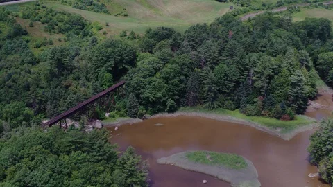 Aerial View of Old Bridge Surrounded by Incredible Scenery Stock Footage 95564584