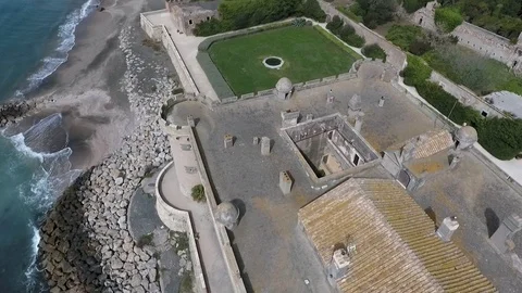 Aerial view of old castle rooftop and sea in background - Castello Odescalchi Stock Footage 89831759