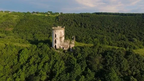 Aerial view of old castle, two towers and forest around Stock Footage 77632737