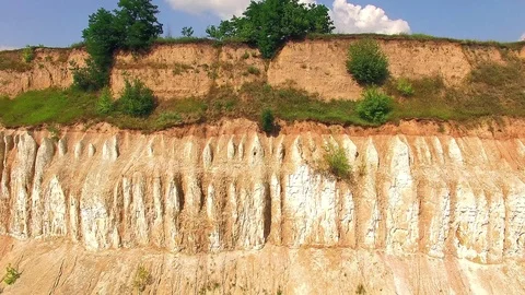 Aerial view of old chalk quarry And the corn field above Stock Footage 100410543