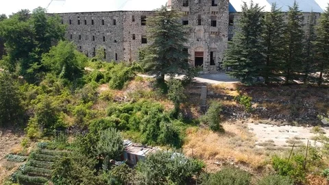 Aerial view of old damaged abandoned building in the forest Stock Footage 87922091