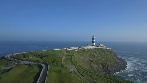 Aerial view of old Head golf and lighthouse ok Kinsale in sunny day - Ireland Stock Footage 84271165