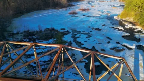 Aerial view of old iron bridge ice and river Stock Footage 304805865