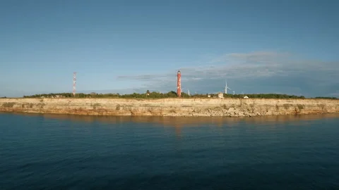 Aerial view of the old lighthouse and wind turbine Video stock 87645889