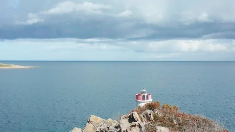 Aerial view of the old lighthouse in cala granu,emerald coast,sardinia 動画素材 127303086