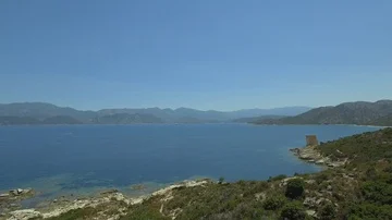 Aerial view of old lighthouse on the cliff of Punta Mortella, Corsica Stock Footage 85471245