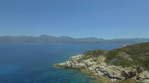 Aerial view of old lighthouse on the cliff of Punta Mortella, Corsica Stock Footage 85471350