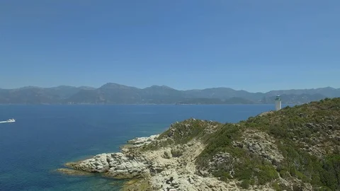 Aerial view of old lighthouse on the cliff of Punta Mortella, Corsica Stock Footage 85471434