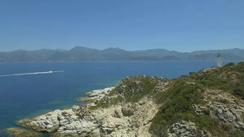 Aerial view of old lighthouse on the cliff of Punta Mortella, Corsica Stock Footage 85471587