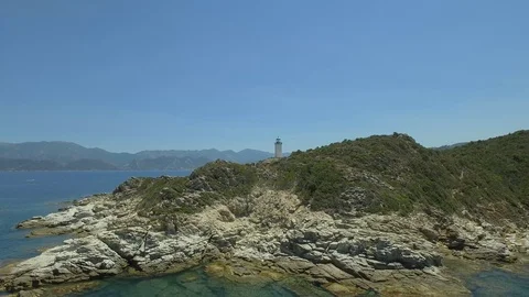 Aerial view of old lighthouse on the cliff of Punta Mortella, Corsica Stock Footage 85556436