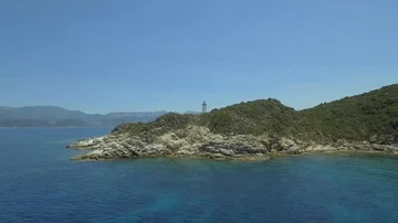Aerial view of old lighthouse on the cliff of Punta Mortella, Corsica Stock Footage 85556453