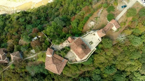 Aerial view of old monastery hiding in the forests, also known as Motsameta Stock Footage 112488323