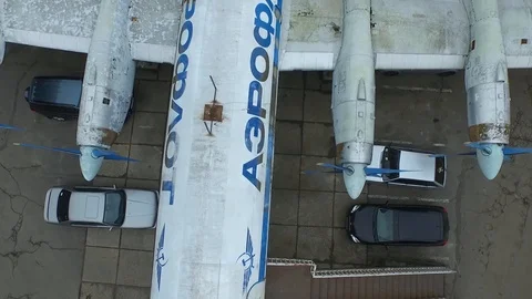 Aerial view of the old plane on the middle of the neighbourhood Stock Footage 91039570
