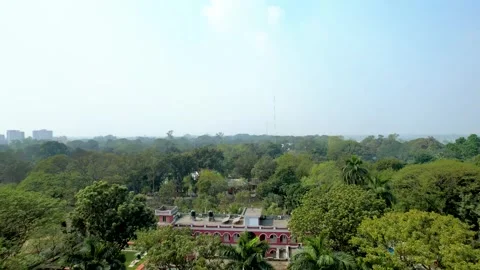 Aerial view of old red building surrounded by jungle in Mymensingh, Banglade Stock Footage 320035707