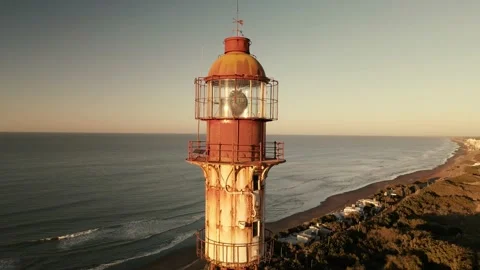 Aerial view of an old rusty lighthouse at sunrise. Stock Footage 151470611