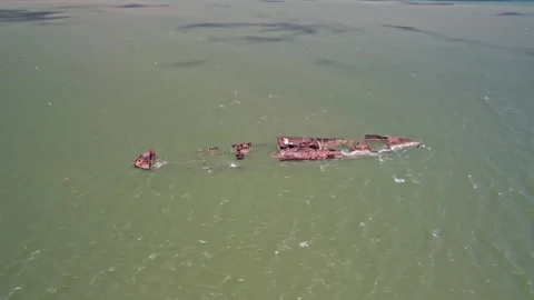 Aerial View of Old Rusty Shipwreck in Green Water - Tutoia, Brazil Stockbeeldmateriaal 331517476