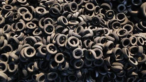 Aerial view of old tires dump. Many car and truck tires on dump site from above Video stock 233164423