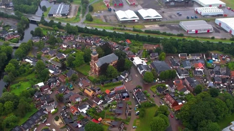 Aerial view of the old town and harbor in the city Farmsum  動画素材 310745237