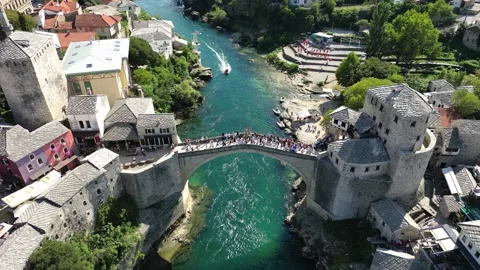 Aerial view of Old Town Mostar famous Old Bridge and Neretva River, Bosnia and Stock Footage 286047654