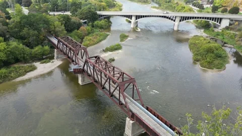 Aerial View of Old Train Bridge + Car Bridge in Downtown Brantford Ontario ( Stock Footage 314285027