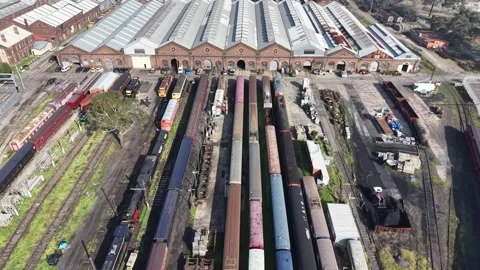 Aerial view of old train depot with multiple railway tracks Stock Footage 339304568