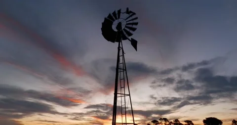 Aerial view of Old Windmill Spinning at Sunset Video stock 227261320