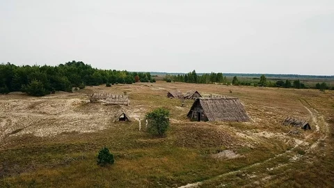 Aerial view of Old wooden structures covered with straw Stock Footage 111082271
