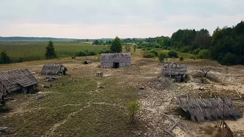 Aerial view of Old wooden structures covered with straw Stock Footage 117853465