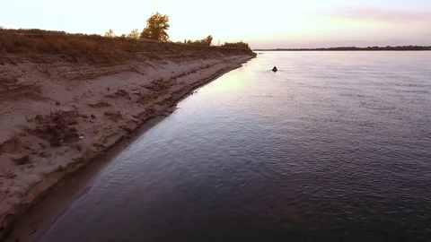 Aerial view of one boat floating on the longest river in Europe called Volga. 4K Stock Footage 73299433