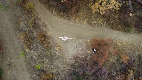 Aerial view. One guy with a beard is on the mountain. Stock Footage 218218272