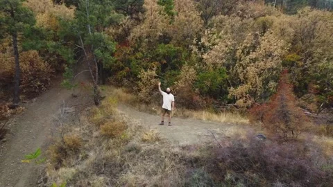 Aerial view. One guy with a beard is on the mountain. Stock Footage 218218353