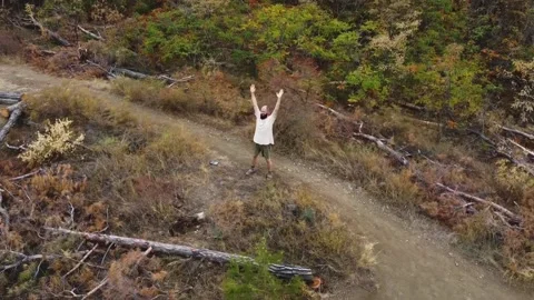 Aerial view. One guy with a beard is on the mountain. Stock Footage 218218840
