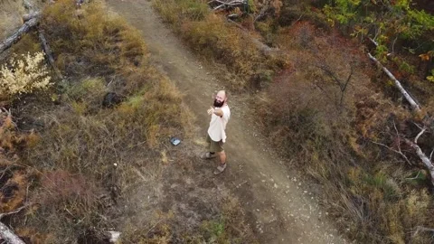 Aerial view. One guy with a beard is on the mountain. Stock Footage 218218869