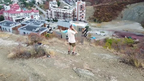 Aerial view. One guy with a beard is on the mountain. Stock Footage 218219049
