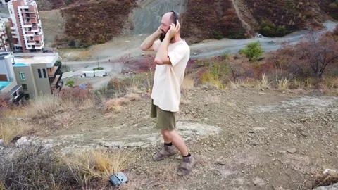 Aerial view. One guy with a beard is on the mountain. Stock Footage 218219070