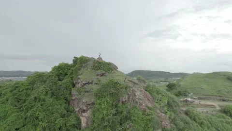 AERIAL VIEW ONE MAN TAVELING IN KUTA MANDALIKA LOMBOK INDONESIA Stock Footage 231849286