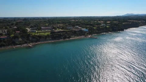 Aerial view of open endless blue sea and premium resort coast in Greece Stock Footage 343940031