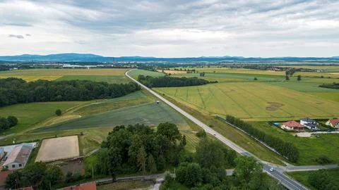 Aerial View of Open Fields and Winding Roads in a Tranquil Rural Landscape Stock Photos