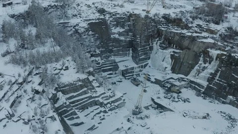 Aerial view of an open granite pit mining in winter Stock Footage 126677407