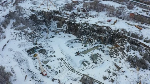 Aerial view of an open granite pit mining in winter Stock Footage 126688141