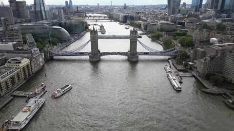 Aerial view of the open lifted Tower Bridge of London, England, a cloudy day Stock Footage 314571459