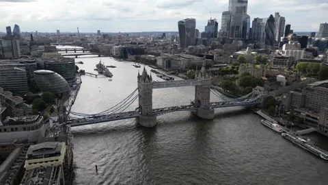 Aerial view of the open lifted Tower Bridge of London, England, a cloudy day Stock Footage 314571479