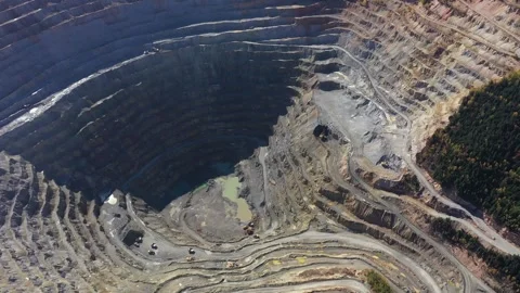 Aerial view of an open pit copper mine. Rosia Montana, Romania Stock Footage 243644238