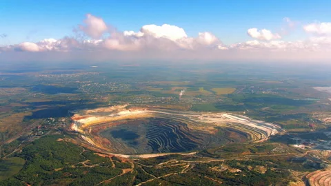 Aerial view of an open pit iron ore quarry and industrial landscape Stock Footage 337017986