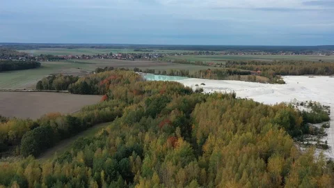 Aerial view of open pit kaolin clay mine (kaolinite quarry) in autumn landscape Video stock 118693434