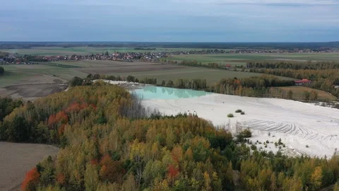 Aerial view of open pit kaolin clay mine (kaolinite quarry) in autumn landscape Video stock 118693556