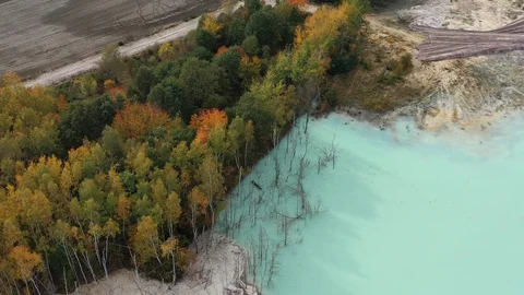 Aerial view of open pit kaolin clay mine (kaolinite quarry) in autumn landscape Video stock 119585723
