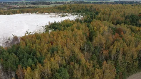 Aerial view of open pit kaolin clay mine (kaolinite quarry) in autumn landscape Stock Footage 119588315